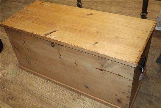 A Victorian pine trunk with hinged top W.112cm